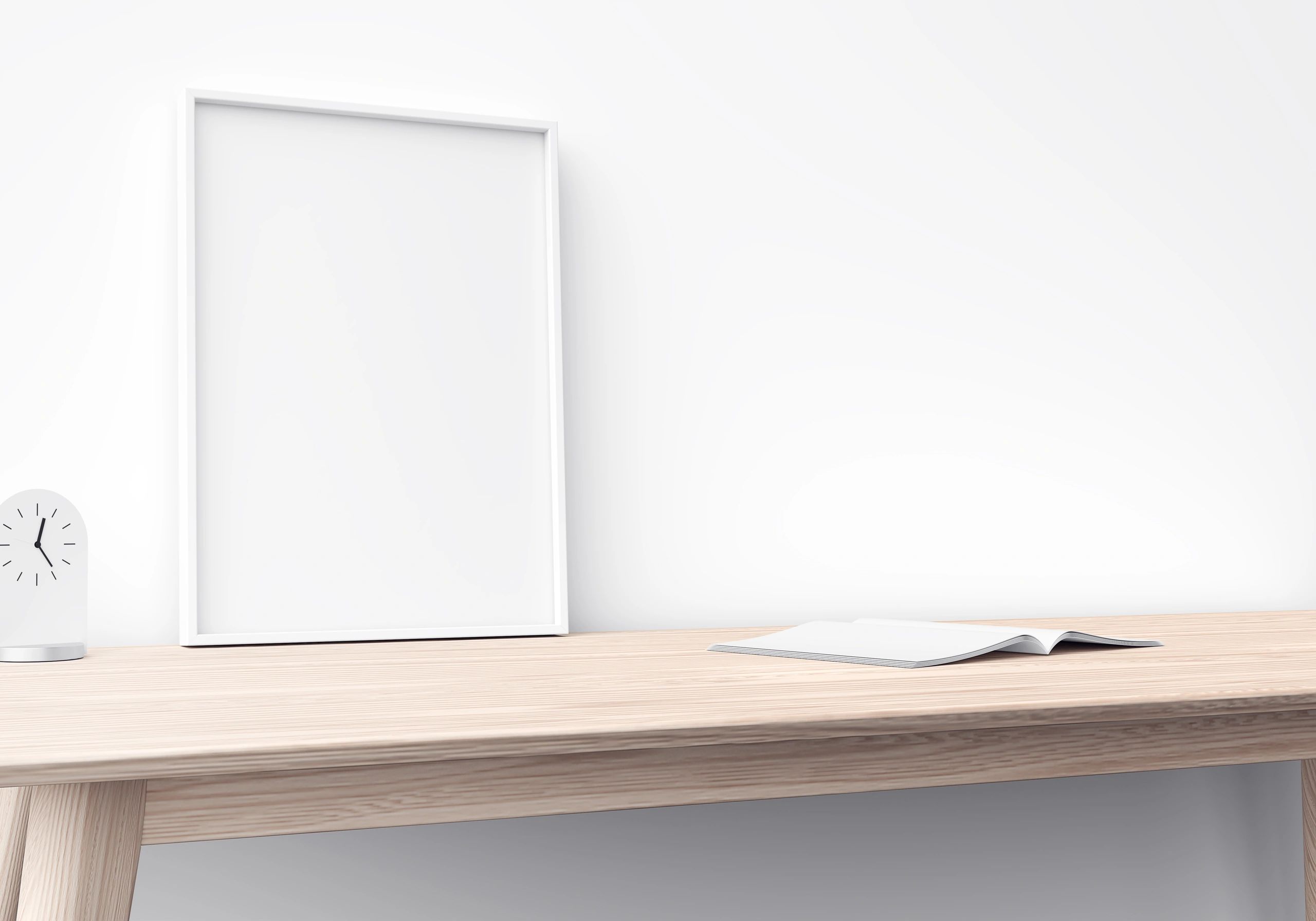 Blank frame on wooden table for art presentation